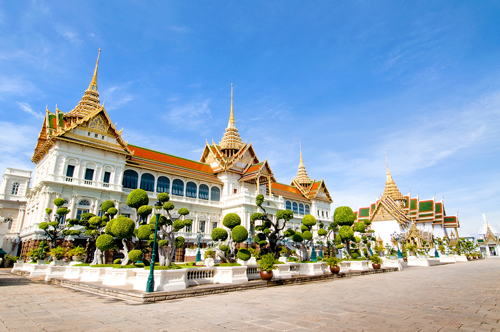 Beautiful beach with turquoise waters and traditional long-tail boat in Thailand - cultural and tropical escape.