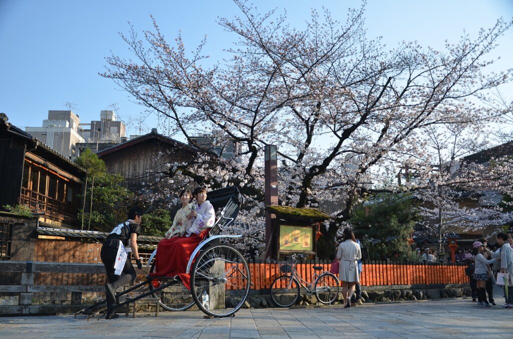 Kiyomizu-Dera Temple in Kyoto surrounded by red and golden autumn leaves, a top destination in November.