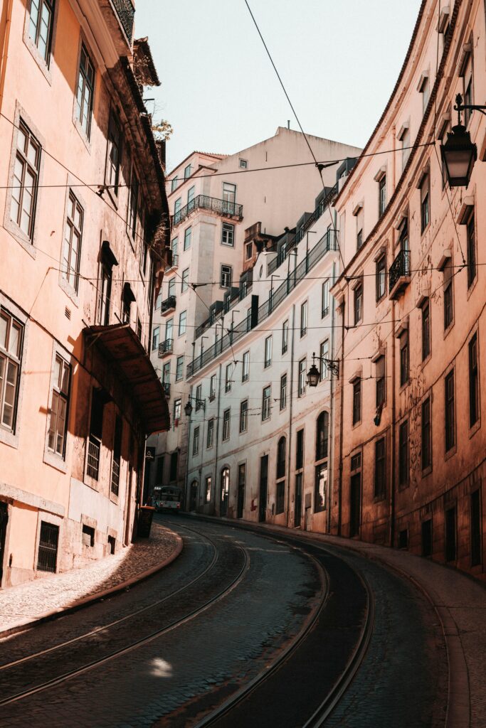 View of Lisbon's Alfama district with colorful houses and the Tagus River.