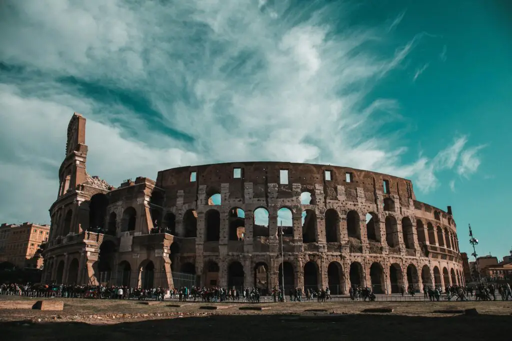 Colosseum in Rome, Italy, with a clear blue sky.