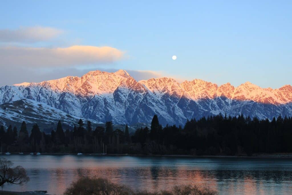 Majestic mountain landscape in Queenstown, New Zealand, under blooming spring skies in November.