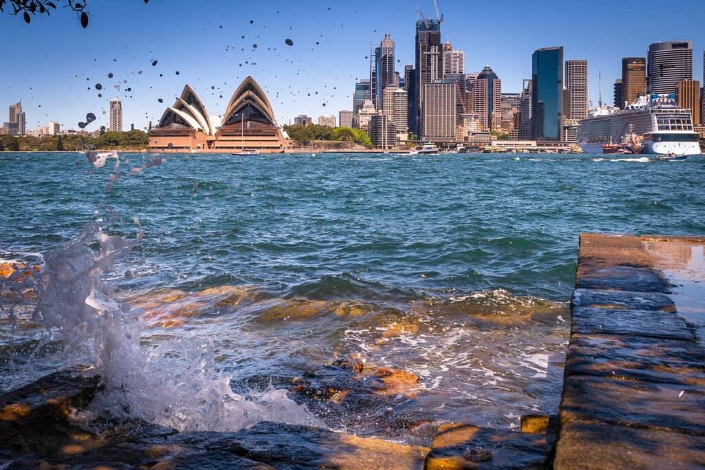 Sydney Opera House and Harbour Bridge with sunny November skies, a must-visit for spring travelers."