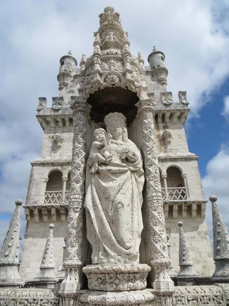 Historic Belém Tower by the water in Lisbon, surrounded by mild November weather.