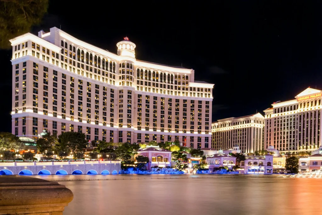 Best places to travel in the US in January: The iconic Bellagio Hotel illuminated at night in Las Vegas, Nevada, reflecting its grandeur across the calm waters of the famous fountains