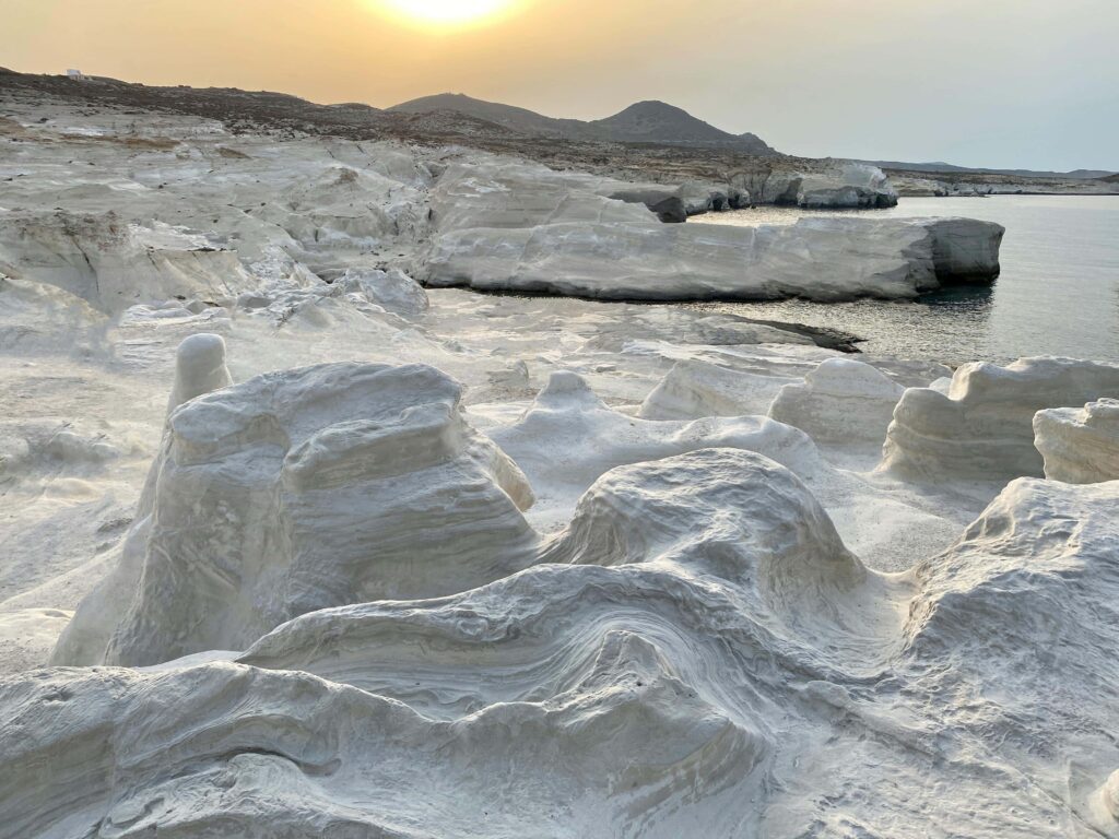 Sarakiniko Beach in Milos with white rock formations and turquoise waters, a unique honeymoon destination