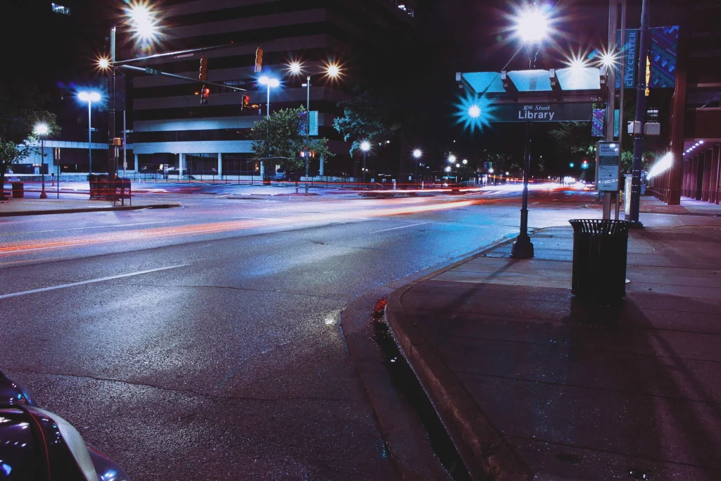 Chattanooga city streets at night with vibrant streetlights and illuminated buildings creating a lively urban atmosphere