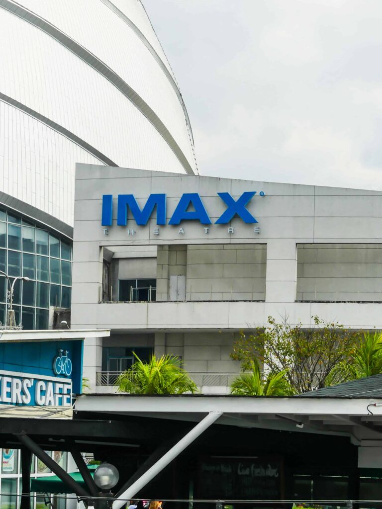 Exterior view of the IMAX Theater at Liberty Science Center, highlighting the state-of-the-art design and large blue IMAX sign, emphasizing the immersive cinematic experience available at Liberty Science Center.