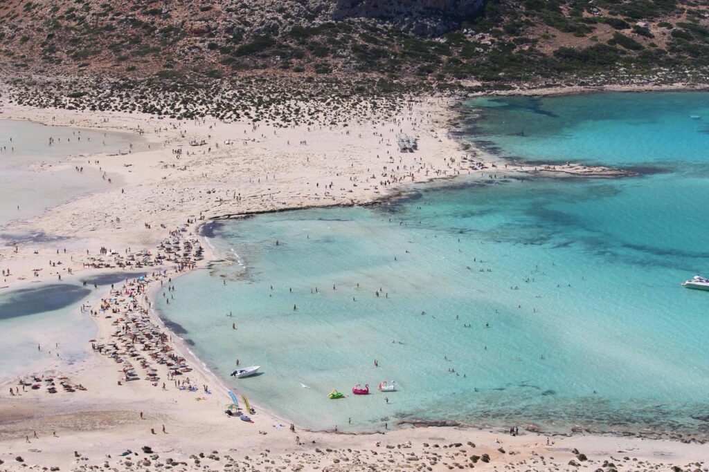 Elafonisi Beach in Crete with pink sands and clear waters, a picturesque honeymoon destination for couples