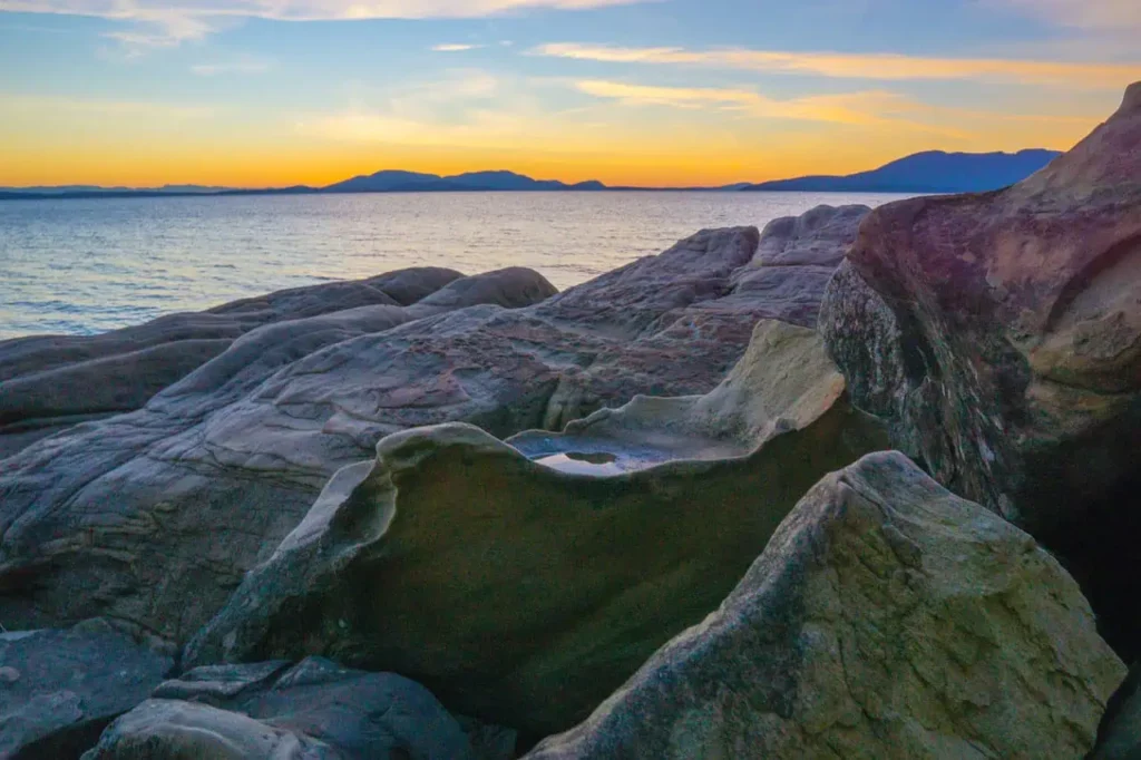 A scenic sunset view over the rocky coastline at Larrabee State Park