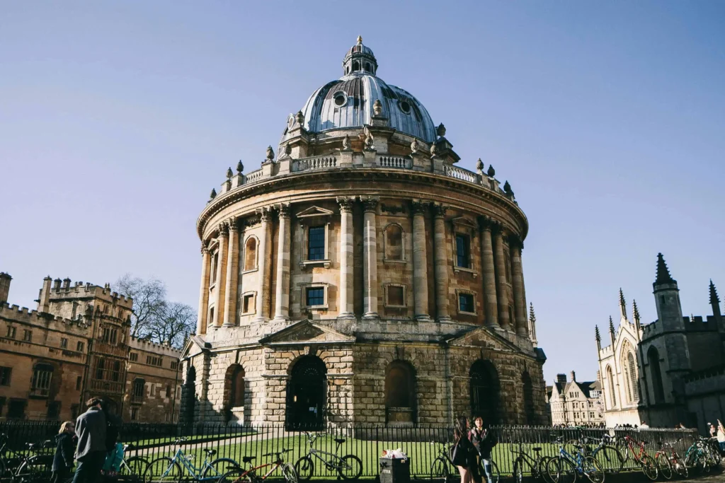 The historic Radcliffe Camera in Oxford, a stunning example of neoclassical architecture under a bright blue sky