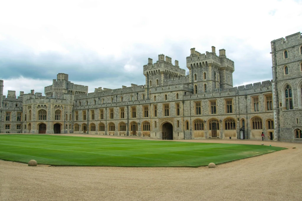 The inner courtyard of Windsor Castle with manicured lawns and historic stone architecture