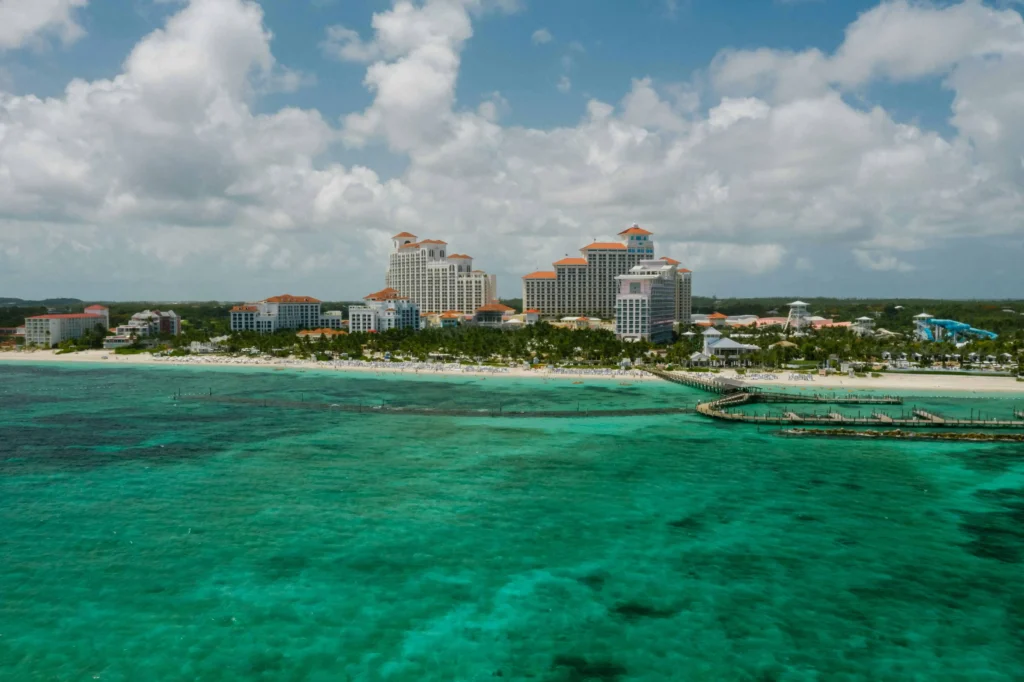 A wide-angle view of the Baha Mar Resort with its grand buildings and vibrant turquoise waters along the coast.