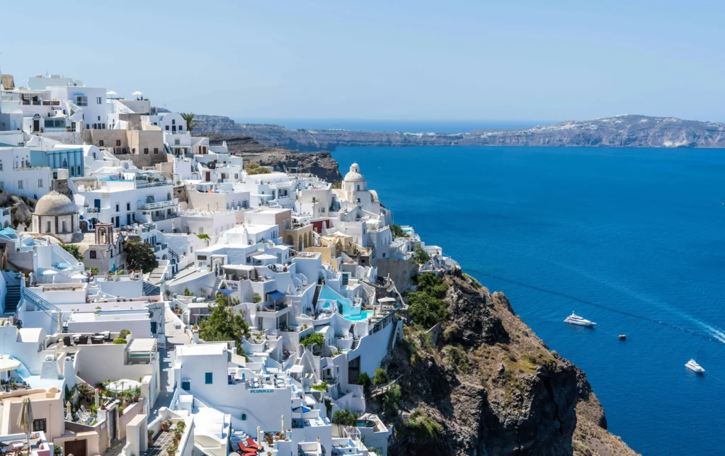 A captivating view of Santorini's cliffside homes and azure waters, a hallmark of this Greek island paradise. 