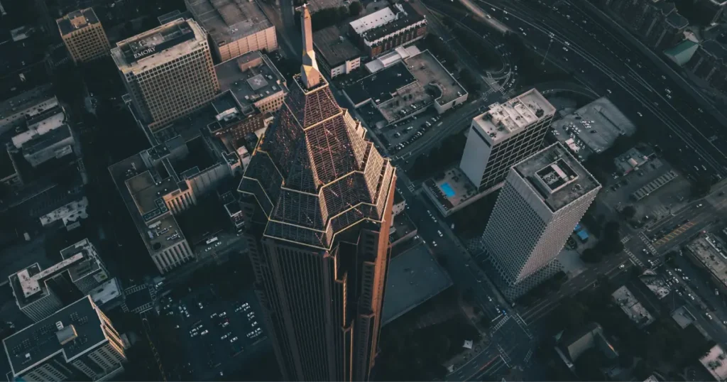 Aerial view of downtown Atlanta at sunset showcasing the city’s skyline and iconic buildings.