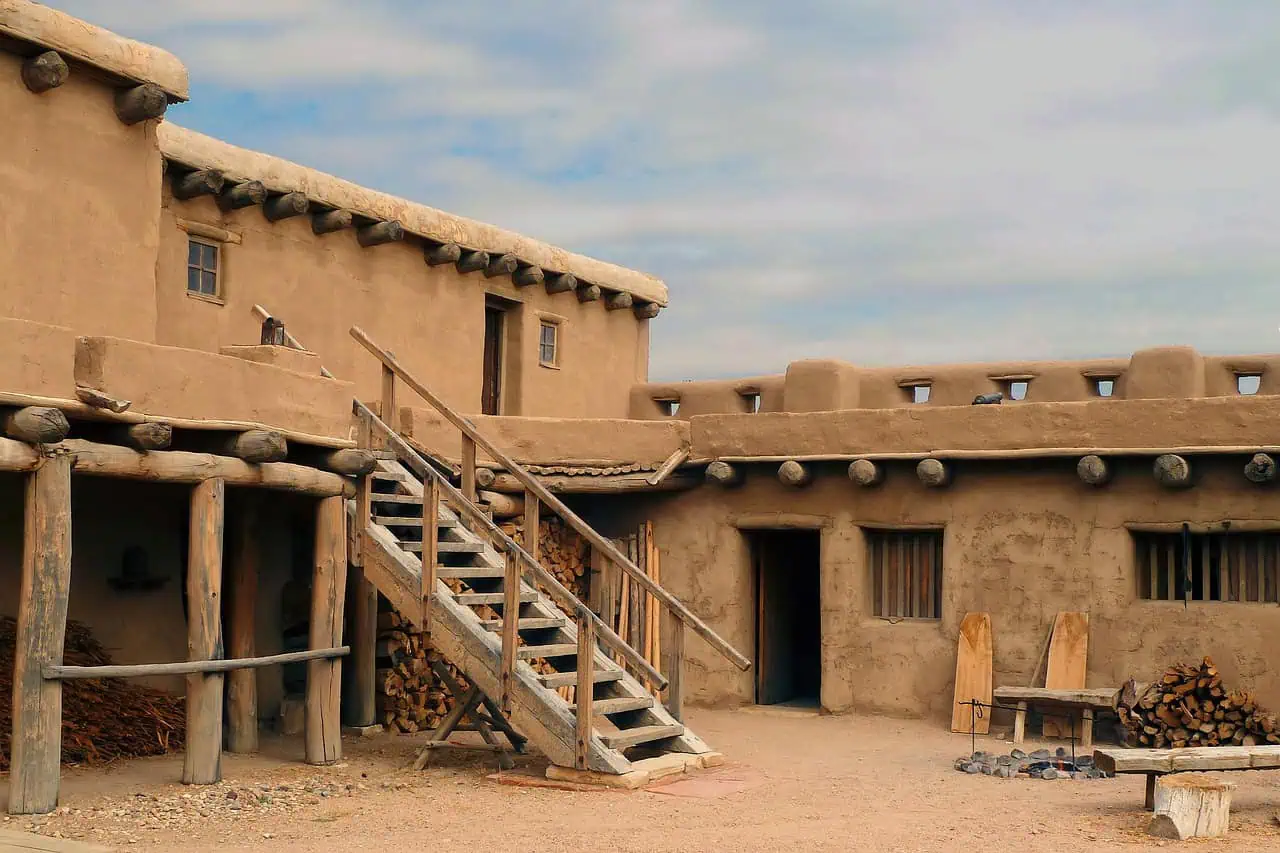 Adobe-style historic fort with a wooden staircase in Santa Fe.