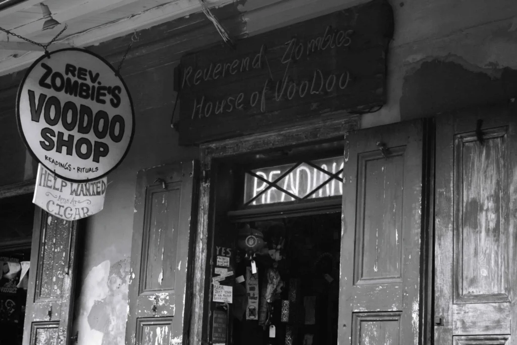 The exterior of Reverend Zombie’s Voodoo Shop in New Orleans, featuring vintage signage with boutique hotels new orleans nearby