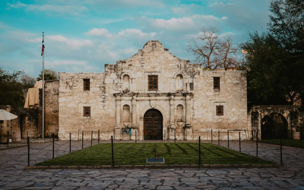 The Alamo under a vibrant sky, a must-visit for couples in San Antonio.