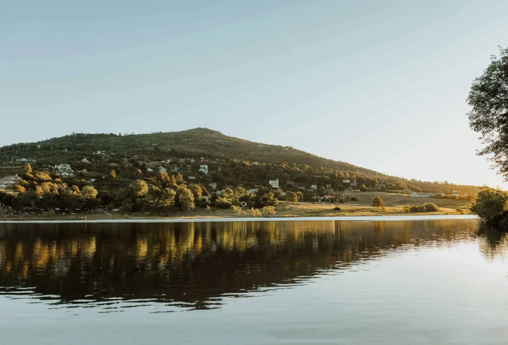 A stunning view of Lake Cuyamaca at sunset, reflecting the golden hills.