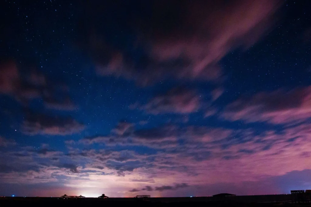 A mesmerizing night sky over the beaches of Dauphin Island, with stars shining brightly.