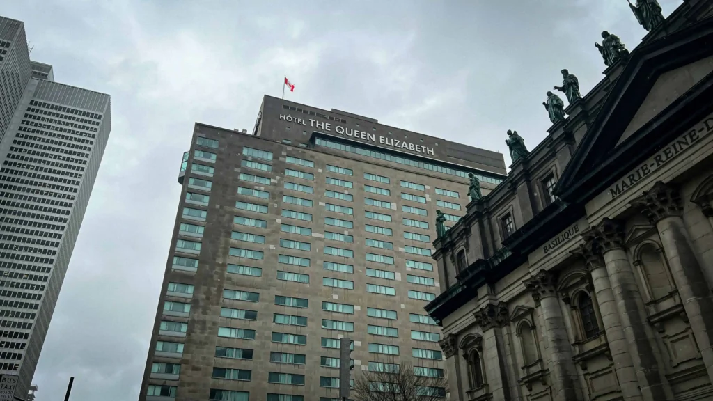 Iconic Queen Elizabeth Hotel in Montreal with a view of the city skyline. one of the best hotels in montreal