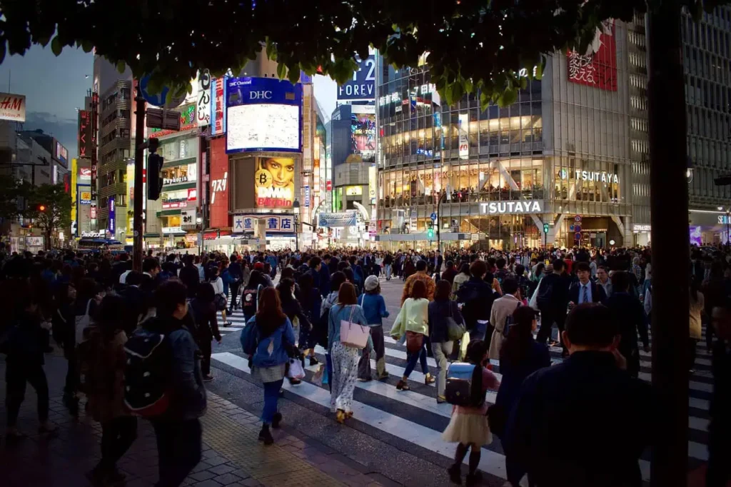 Tokyo’s bustling Shibuya Crossing with illuminated skyscrapers