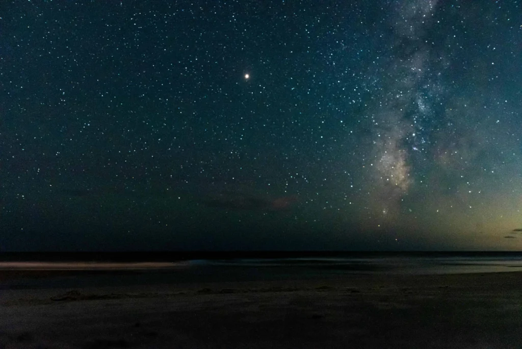 A stunning night sky with countless stars over the beach at Oak Island, NC.