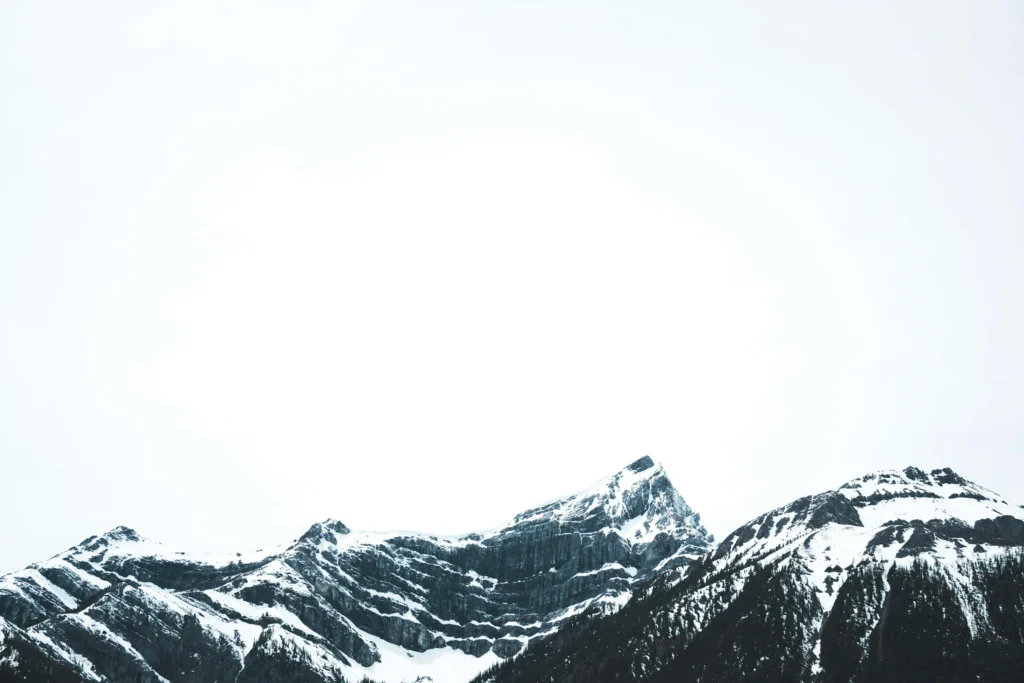 A striking winter landscape featuring snow-covered mountains.