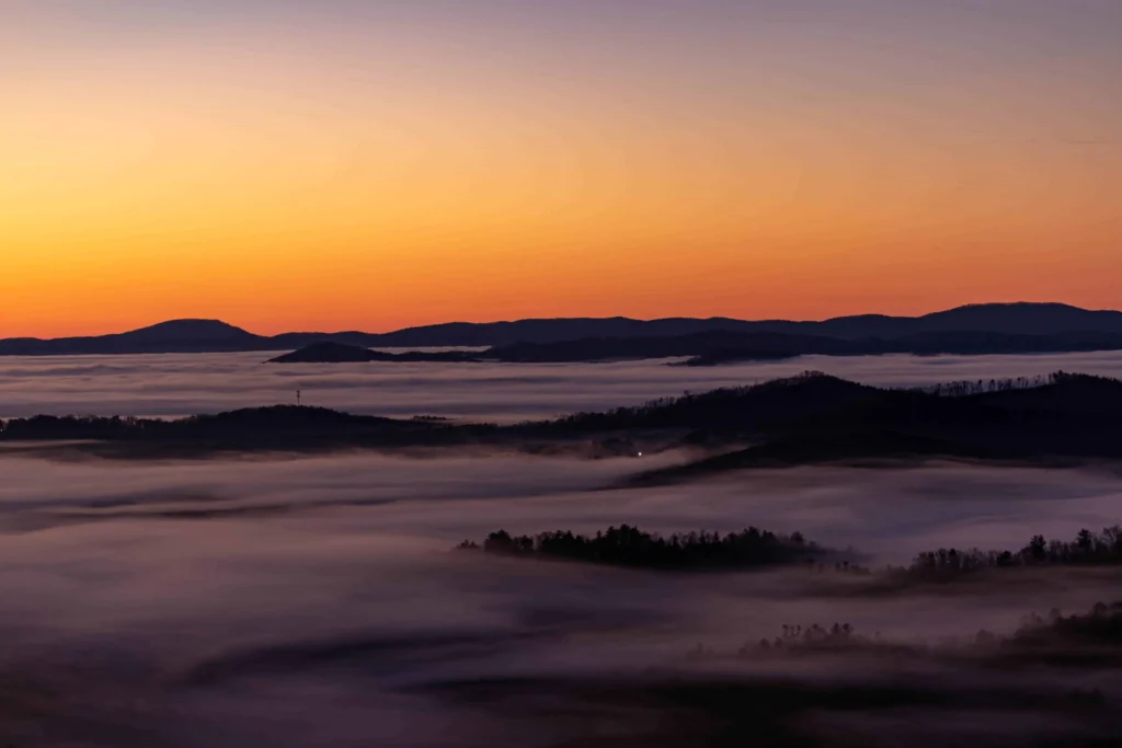 Sunrise over the misty Blue Ridge Mountains in Boone, North Carolina.