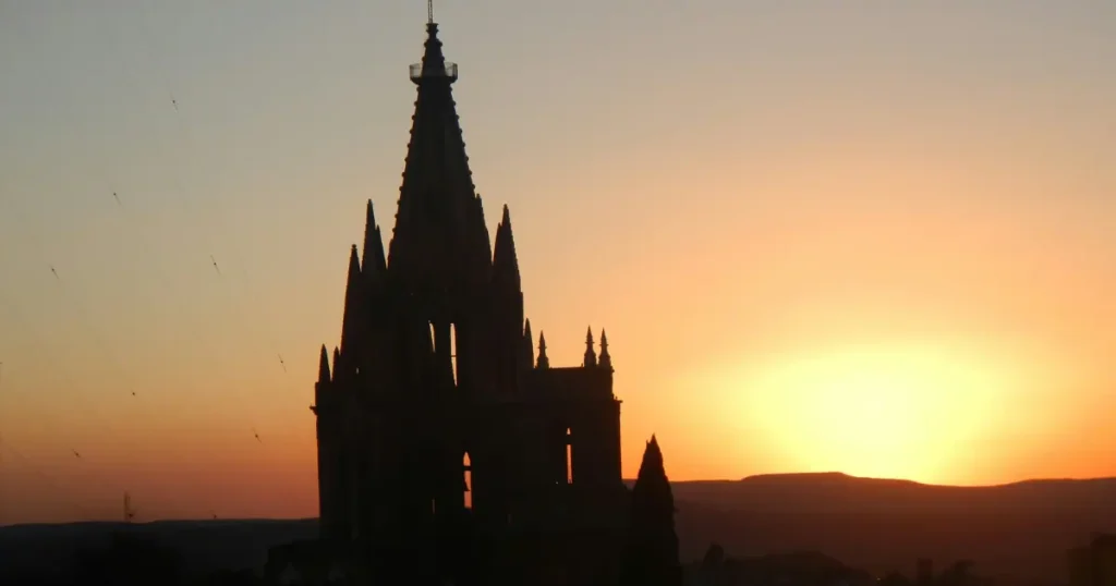 The stunning silhouette of Parroquia de San Miguel Arcángel at sunset in San Miguel de Allende, Mexico.