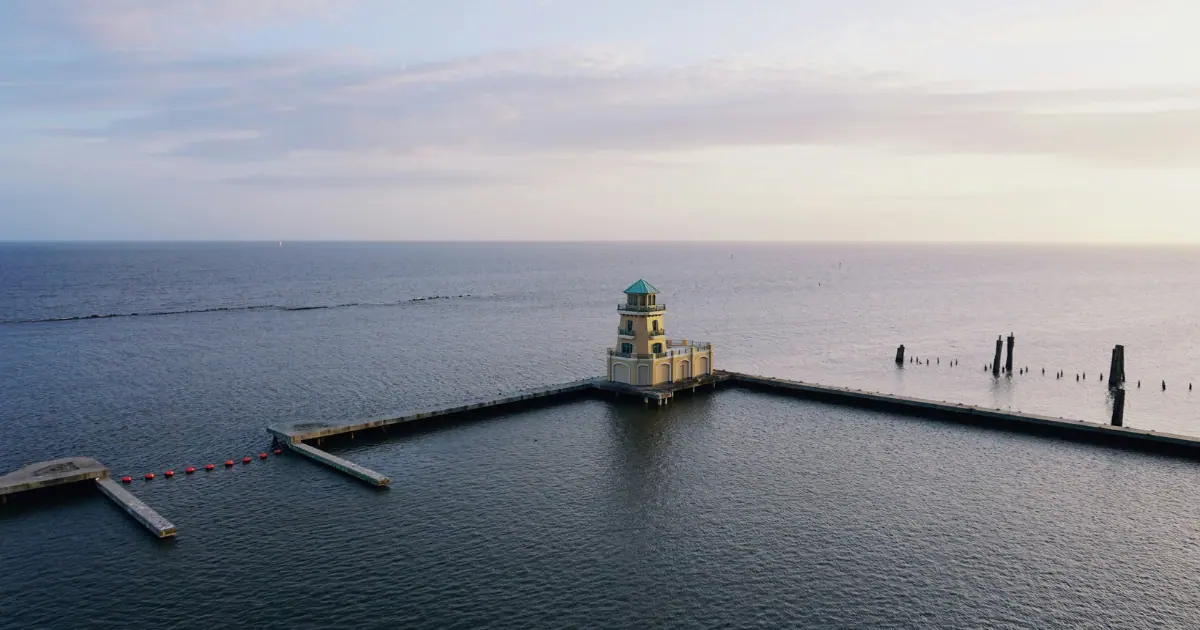 A beautiful lighthouse surrounded by the Gulf of Mexico in Biloxi, MS, a must-see attraction.