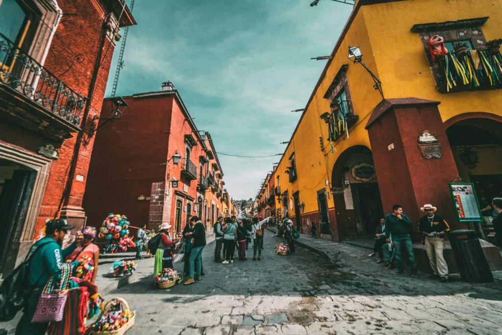 Colorful colonial streets filled with locals and tourists in San Miguel de Allende, Mexico.